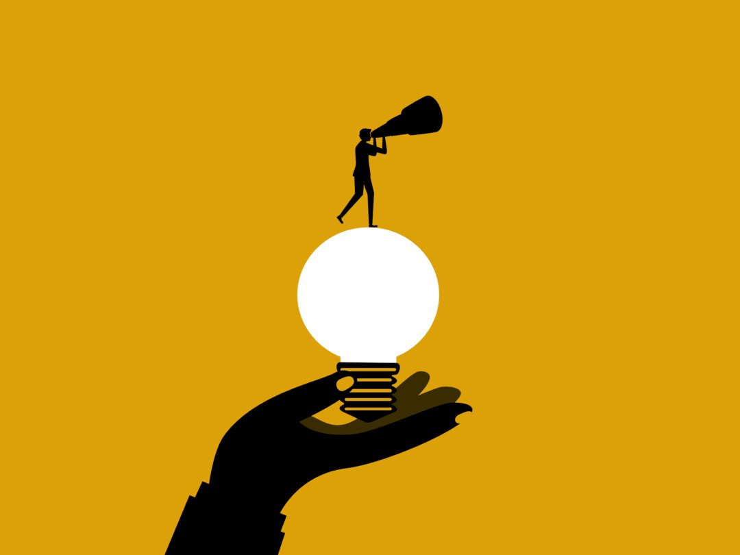 Creativity and new ideas. Businessman standing on light bulb with binoculars